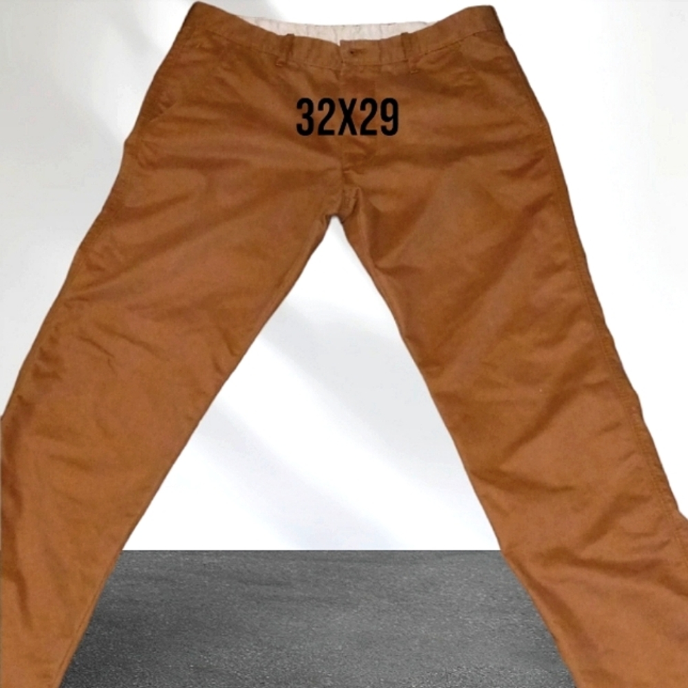 Ls pants made in Mexico the size is a 32x29 they are a darker orange color.